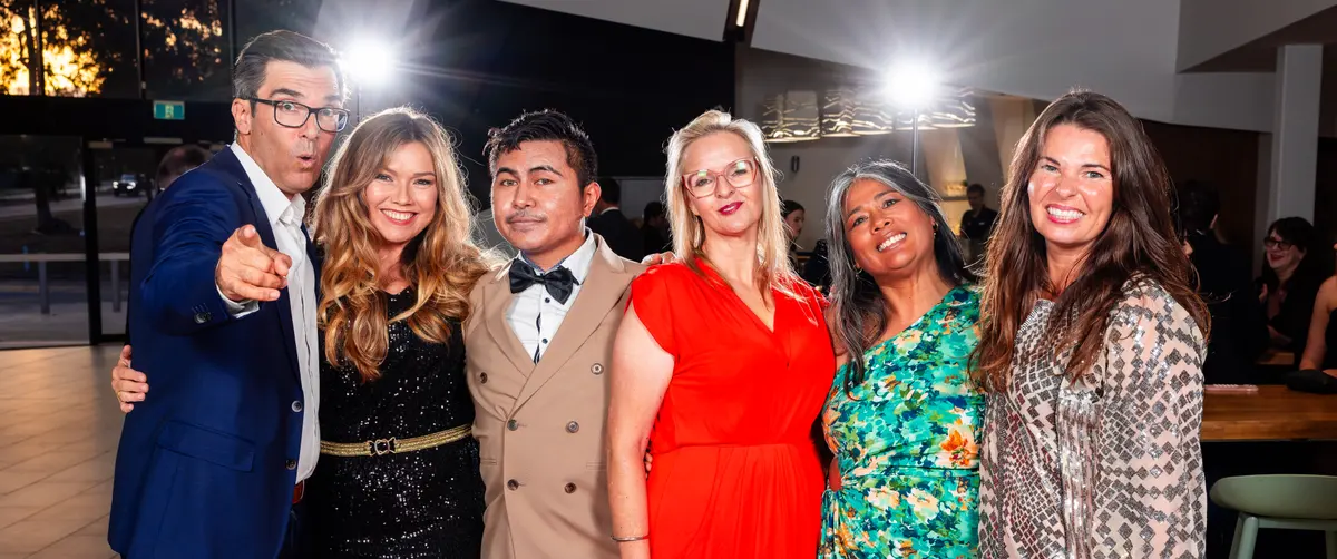 Filmmakers arm in arm on the AFIN red carpet at the 2025 festival.
